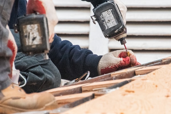 Roofing crew installing new shingles on residential home
